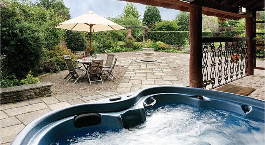 Relax in the hot tub at Bearwood House