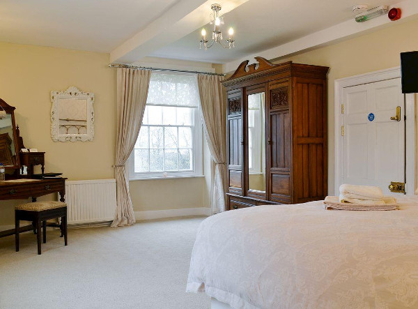 One of the four bedrooms at Hindwell Farmhouse in Walton near Presteigne
