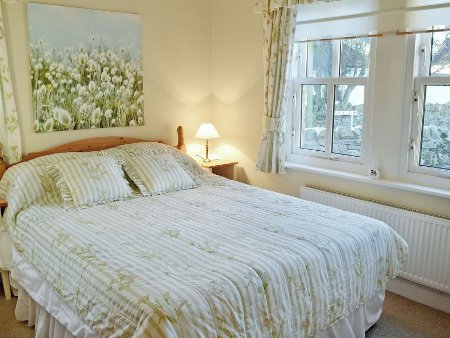 A bedroom at Craster Cottage, Beadnell