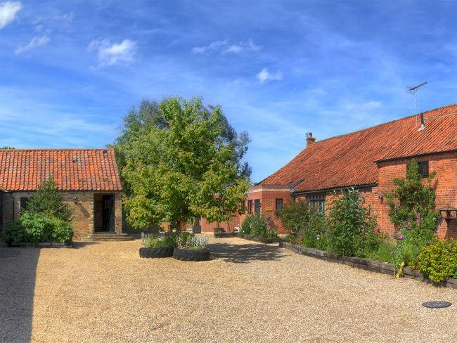 Pantile Barn in Holt is a large holiday cottage sleeping 10 people with a hot tub